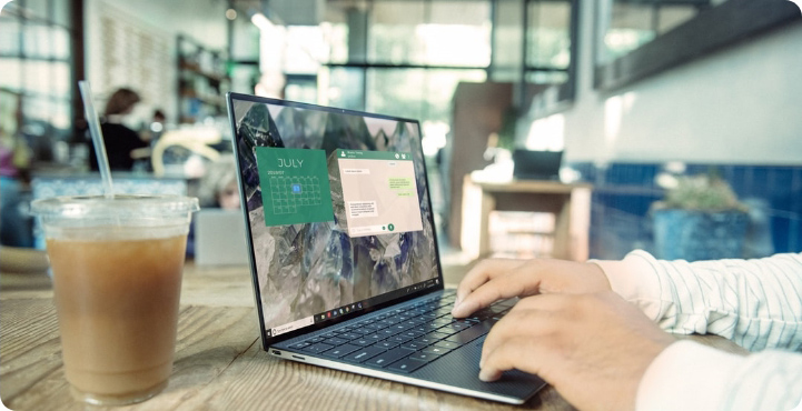 An image of a person working on a laptop