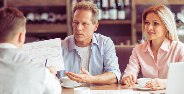 An image of three people having a discussion